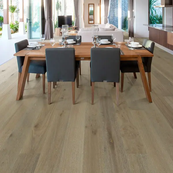 Bordeaux 2 Dining room scene - 6 blue chairs around a rood table. Large room with wood plan flooring.