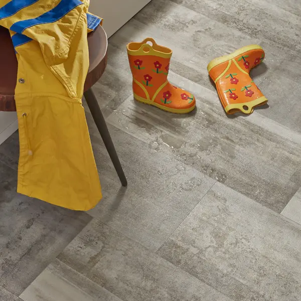 wpLVP_2 Entryway scene - raincoat draped on table, rain boots on waterproof LVP floor.