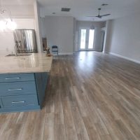 Service – Excellent! Home entryway and kitchen with wood-look lvp flooring.