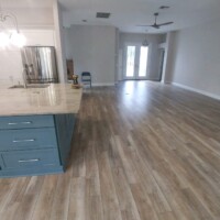 Service – Excellent! Home entryway and kitchen with wood-look lvp flooring.