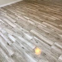 Excellent. Room with brown/grey wood-look lvp flooring.